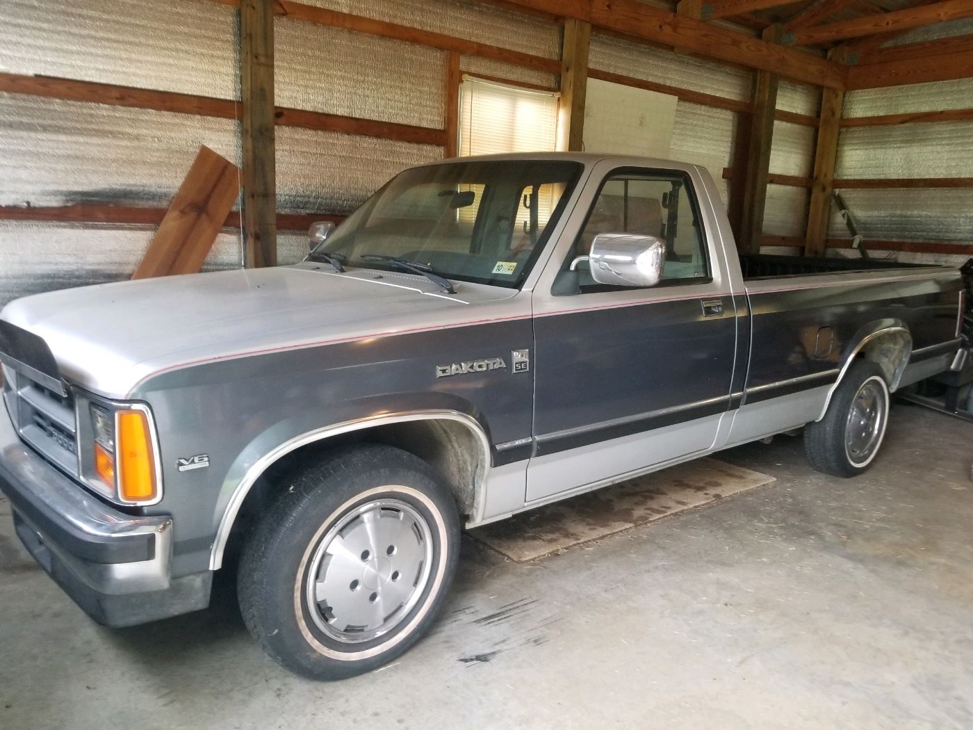 1987 DODGE DAKOTA PICKUP. V6, 4x4 in imacculate condition. Garage kept, low mileage.  Runs and needs a few mechanical repairs but body and interior are in immaculate condition. Comes with long bed and Leonard bed liner. 