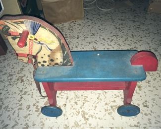 Vintage Antique Wooden Riding Toy with steel wheels