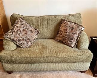 Nice light beige loveseat with accent pillows 