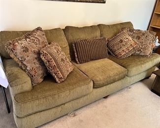 Nice large beige sofa with accent pillows 