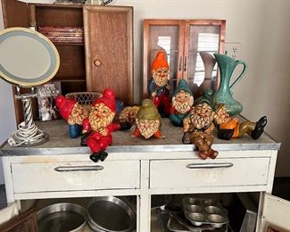 Vintage metal, kitchen cabinet, small assortment of bakeware, and gnomes!