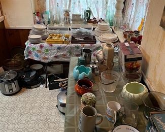 I know this will seem silly, but in the kitchen are kitchen appliances, mugs, vases, and flatware.  You might have noticed there are a lot of dishes shown in several pictures.