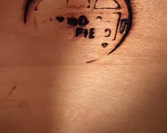 The dresser is made by Heywood Wakefield and this is the maker's mark inside.