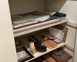 The fourth shelf down has a pair of wooden shoes.  We in the US tend to think these were only worn by the Dutch, but others wore similar shoes as garden shoes over regular cloth shoes.