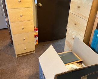 The blonde-wood cabinets are not filing cabinets but drawers.  They are pretty though.