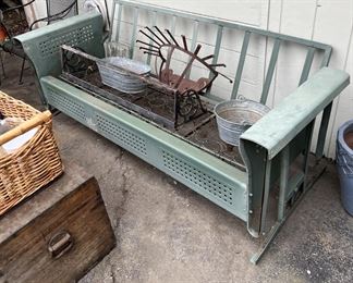 While the exact year is not clear, this is a vintage glider sofa frame, possibly from the 1940s.
