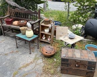 The far right appears to be a compost bin, which is a great way to create fertilizer for your garden and recycle your food scraps.