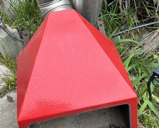 This metal outdoor fire pit is used but in good condition.