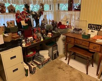 You can see a number of the holiday decorations on the left hand table between the two filing cabinets.