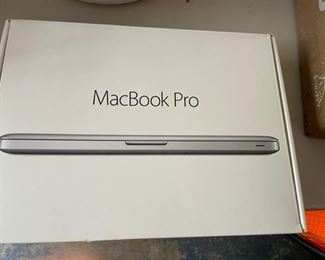 MacBook Pro in box.