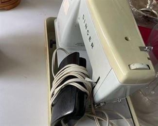 Singer sewing machine in case.