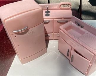 Plastic doll house kitchen set.