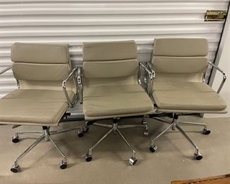 8 Mid-Century Modern office chairs with leather seats $75 each.