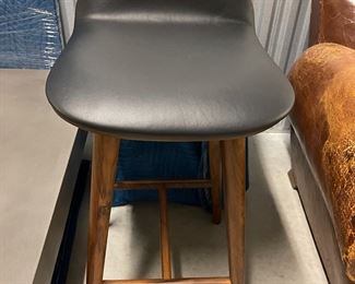 Two walnut and leather "counter-height" bar stools $200