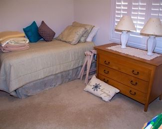Twin bed, wood dresser with lamps