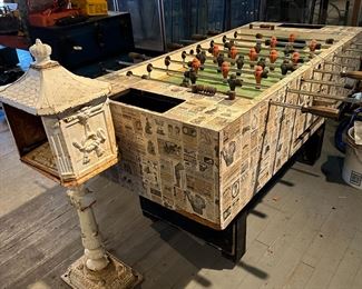 Foosball table and old solid cast iron mail box