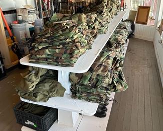 new cammo clothing as well as military sleeping bags, ponchos, backpacks, etc.