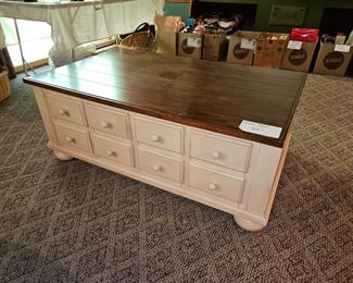 $50 Creme & Wood Coffee table with 8drawers