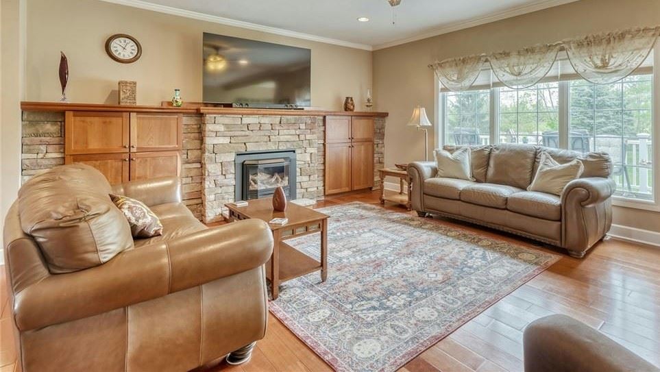 Pr brown leather sofas, coffee table and large Samsung