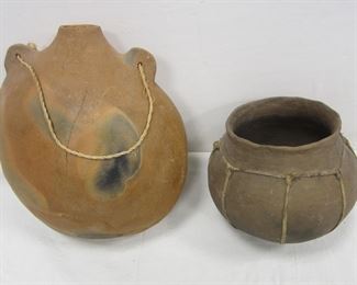 PRE-COLUMBIAN TYPE CLAY POT WITH LEATHER BAND, AND TERRA COTTA WATER JAR. FIRING FLAW ON ONE SIDE OF JAR. JAR IS 9.5"