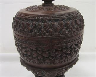ORNATE CARVED WOOD COVERED COMPOTE. 16.25" TALL. SOME SPLITS FROM SHRINK