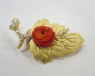 GOLD TONE FLOWER PIN WITH RHINESTONES AND CARVED CORAL ROSETTE. 2" LONG

