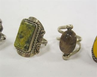 FOUR COSTUME RINGS