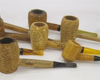 EIGHT CORN COB PIPES AND ONE PIPE BOWL. ADVERTISERS OF SOUVENIRS