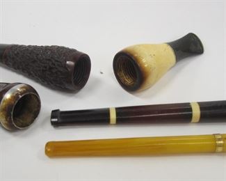 THREE VINTAGE CIGAR HOLDERS AND TWO CIGARETTE HOLDERS