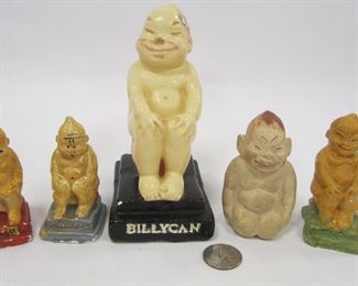 FIVE CHALK WARE FIGURES OF BILLIKEN. THREE ARE SOUVENIR SHAKERS, OTHER TWO ARE FIGURES
