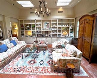 Custom down sofa and chairs, Oriental rug, antique French gate custom coffee table, antique French armoire
