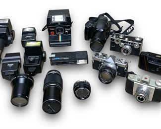 Huge Lot of Vintage Film Cameras, Lenses and Other Camera Accessories Including: A Olympus Om-1 35mm Film Camera, An Olympus Is-3 Dlx 35mm Slr Film Camera, An Argus C3 Vintage Black 35mm Film Camera, and Other Vintage Film Cameras and Equipment!
