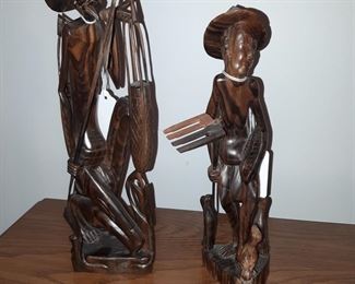 Carved wood, unsigned, first bedroom to the right of the entryway.