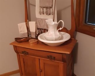 Washstand is in the main bedroom, to the right of the entryway
