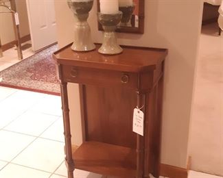 Console and candles. left of the front door, between the entryway and dining room.  This piece says to me, "Hey punk! Where is my key bowl?"  I will fix this.
