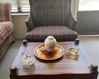 plaid wing back chair and coffee table