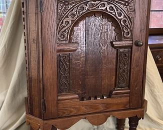 Indonesian spice cabinet.  The legs were added, this piece can hung on the wall wihout the legs.