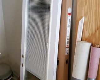 Solid wood ext. w/ encased blind 32x80. Larson Storm w/ screen-away upper 36x80-81