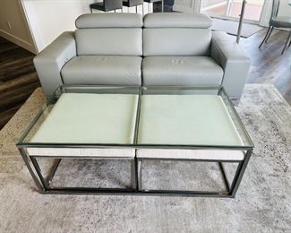 Giuseppe & Giuseppe leather sofa, glass topped coffee table with two nesting ottomans