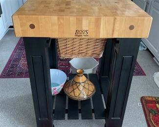 John Boos and Co. Gathering Table Block. 4” thick solid end grain 36”x24”. Maple Top. Contains two large wicker baskets mounted beneath the top. 