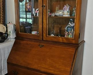 Lovely traditional style secretary with glass doors for display.