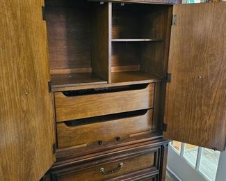 The armoire offers lots of storage and a place for TV or other entertainment devices.