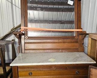 A nice Eastlake dresser with marble top.  The mirror is not broken, it just is not attached.