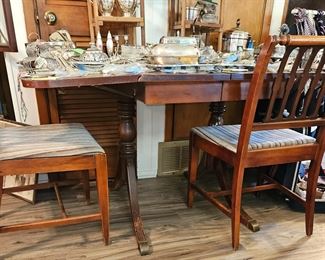 Duncan Phyfe style dropleaf dining table with 6 chairs.