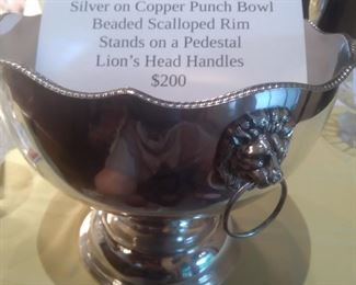Beautiful silver phbch bowl with lions head handles.