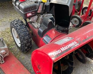 Powered snow thrower.