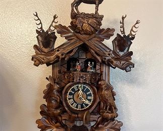 Black Forest clock. Very intricate. Three weights. 