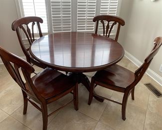 #180 Wood 48-inch round pedestal table with 4 heavy chairs 
