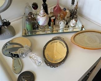 Perfume bottles, vintage mirrors and vanity trays