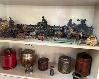 Another view of the cast iron pieces and tobacco canisters - vintage